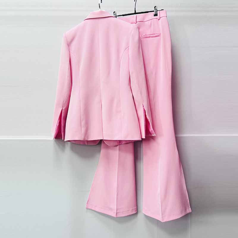 Elegant pink women's pantsuit for wedding, featuring a tailored blazer and flared pants