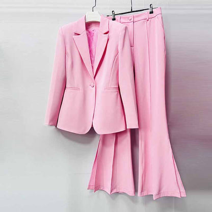 Stylish pink women's pantsuit for wedding featuring a tailored blazer and wide-leg trousers