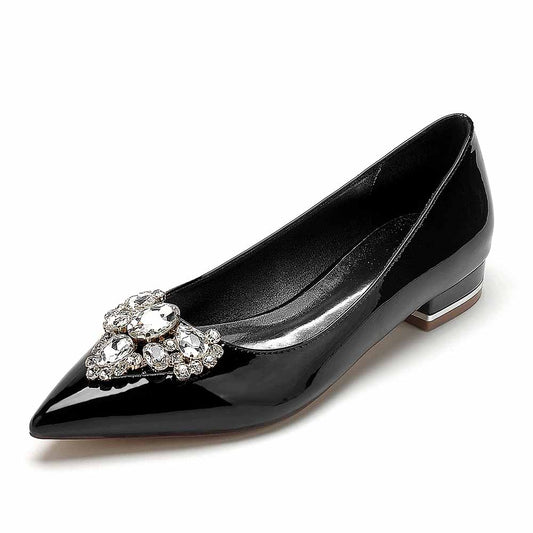 Elegant black point toe bridal flats with a sparkling jewel embellishment for wedding attire
