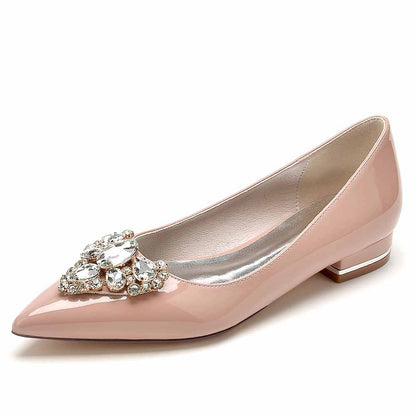 Elegant point toe bridal flats in blush pink with jeweled embellishment for weddings