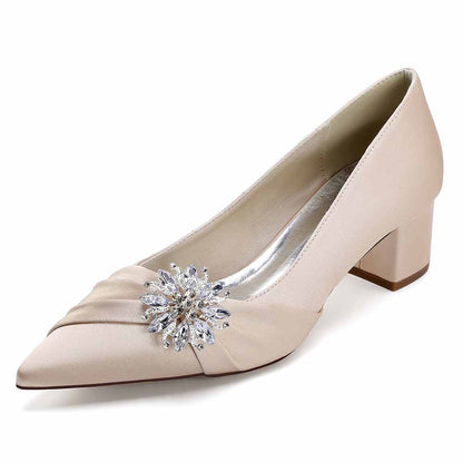 Elegant pointed toe wedding shoes for bride with a sparkling decorative detail in blush