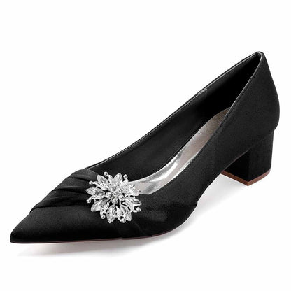 Elegant black pointed toe wedding shoes for bride with a decorative crystal embellishment