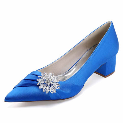 Blue pointed toe wedding shoes for bride with embellished floral detail and chic block heel