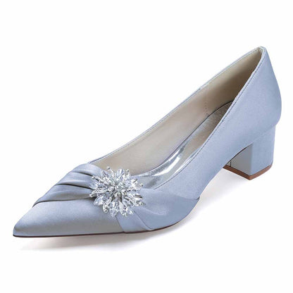 Blue satin pointed toe wedding shoes for bride with embellished flower detail