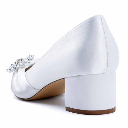 Elegant pointed toe wedding shoes for bride with a satin finish and decorative embellishment