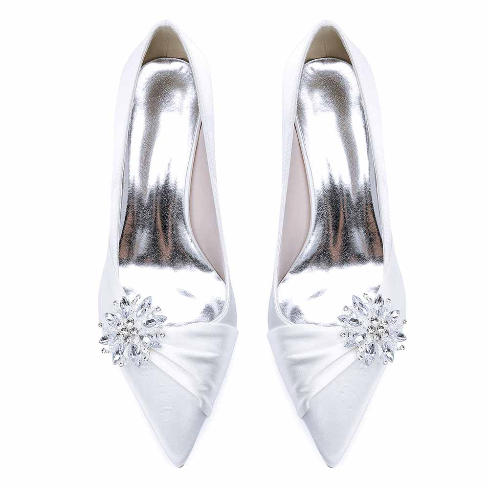 Elegant white pointed toe wedding shoes for bride adorned with a sparkling rhinestone embellishment