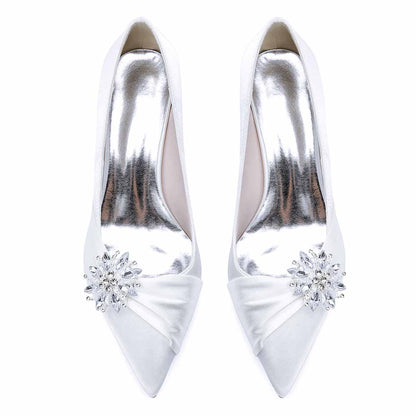 Elegant white pointed toe wedding shoes for bride adorned with a sparkling rhinestone embellishment