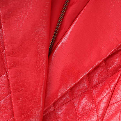 Close-up of the red faux leather mini dress showing quilted details and zipper finish
