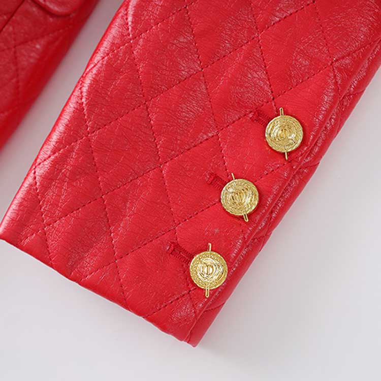 Close-up of sleeve detail featuring buttons on a red faux leather mini dress from Dress