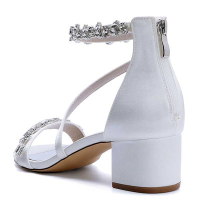 Elegant white rhinestone bridal heels with a stylish ankle strap and block heel design