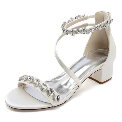 Elegant rhinestone bridal heels with a delicate strap design and block heel for comfort on your special day