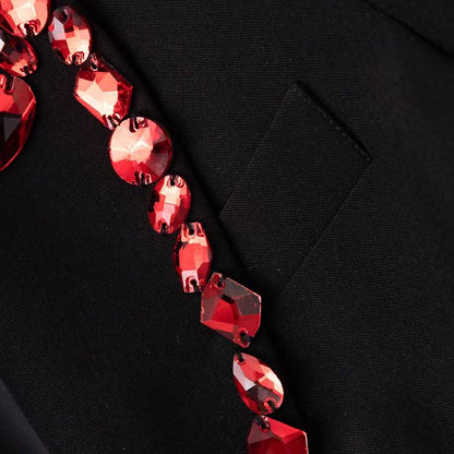 Rhinestone embellished black blazer featuring elegant red crystal detailing on the collar