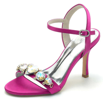 Pink bridal rhinestone stiletto heels with sparkling gemstones for elegant wedding footwear