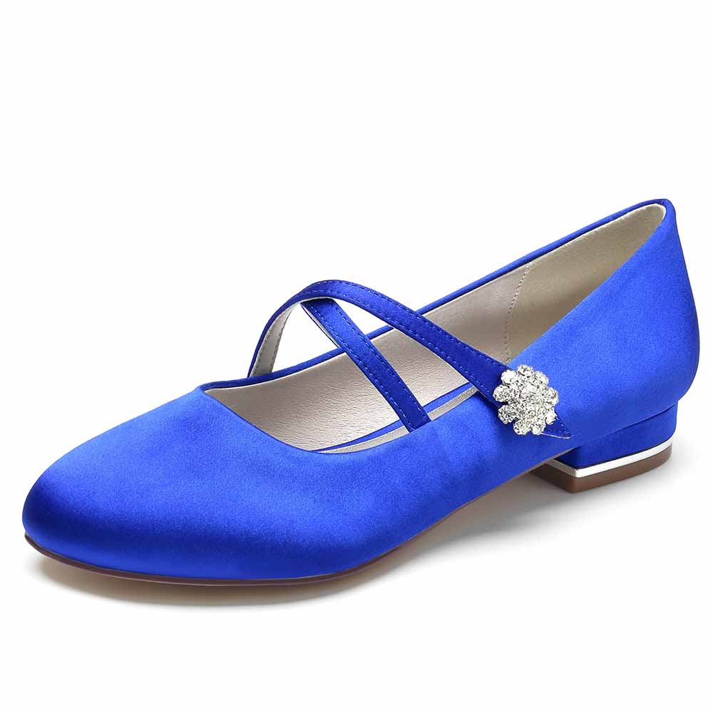Blue satin bridal flats with crisscross straps and decorative flower detail for weddings