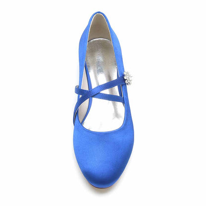 Royal blue satin bridal flats with elegant cross strap and decorative accent for wedding day comfort