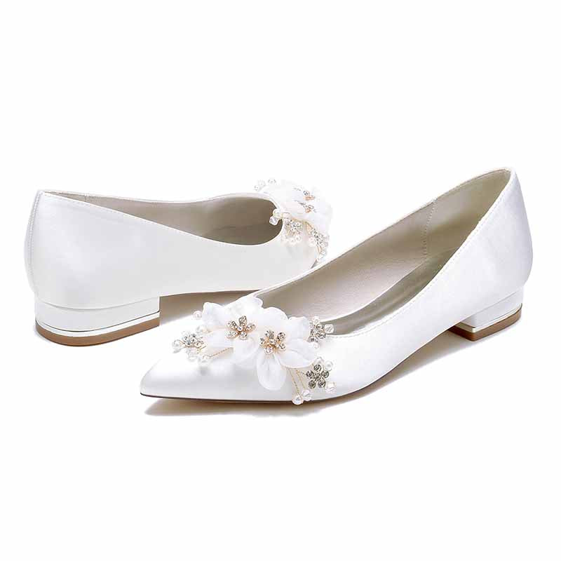Elegant satin bridal flats for women adorned with floral embellishments for a stylish wedding look