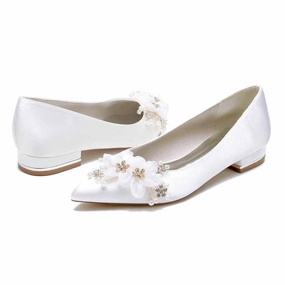 Elegant satin bridal flats for women adorned with floral embellishments for a stylish wedding look