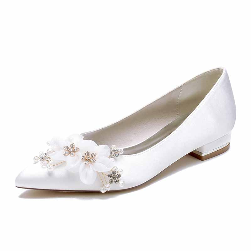 Elegant satin bridal flats for women featuring decorative floral appliques and a pointed toe design
