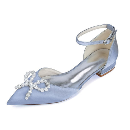 Elegant satin bridal flats in light blue with pearl embellishments and ankle strap for weddings