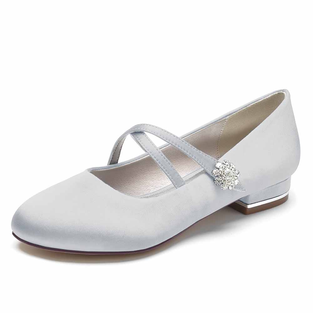 Elegant satin bridal flats in light blue with cross straps and a chic embellishment