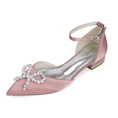 Elegant pink satin bridal flats with pearl embellishments and ankle strap for weddings