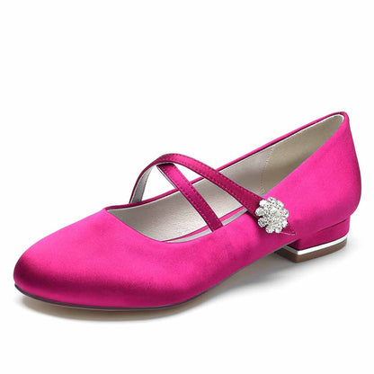 Pink satin bridal flats with decorative flower and cross strap design for weddings