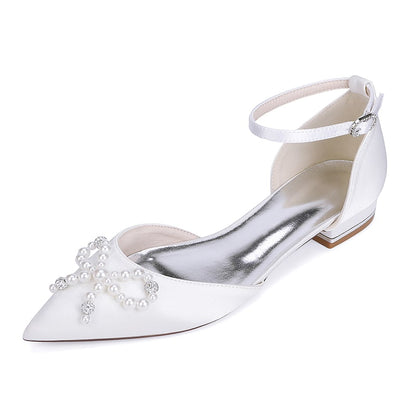 Elegant satin bridal flats featuring a pearl and crystal embellished design with ankle strap
