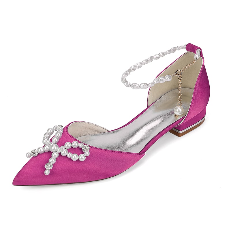Pink satin bridal flats with pearls featuring a unique cross design and ankle strap