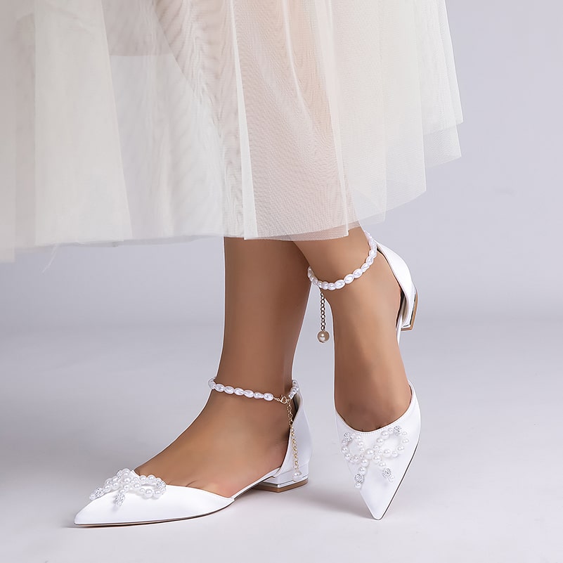 Elegant satin bridal flats with pearls, featuring a stylish design ideal for weddings