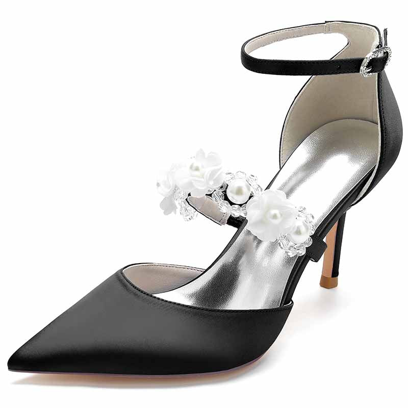 Black satin bridal heels with ankle strap and floral embellishments for elegant wedding attire