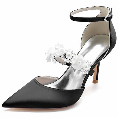 Black satin bridal heels with ankle strap and floral embellishments for elegant wedding attire