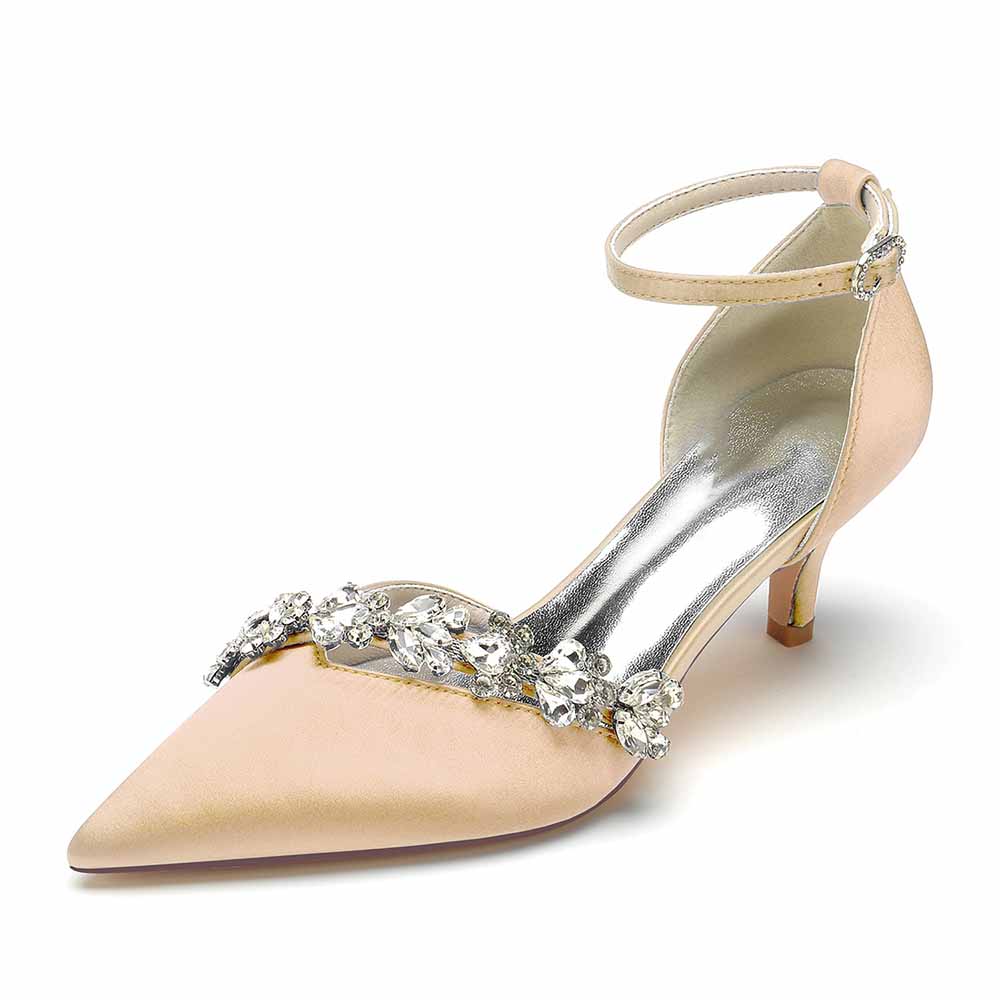 Elegant satin bridal heels with ankle strap, featuring a decorative crystal embellishment and pointed toe