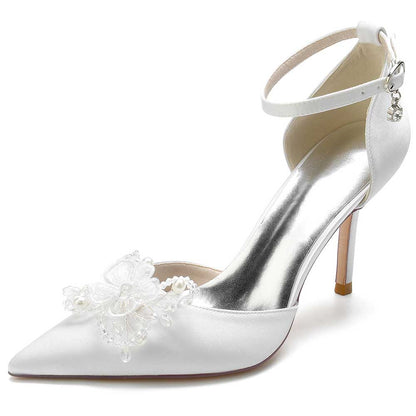 Elegant satin bridal heels with crystals and floral embellishment, perfect for weddings and special occasions