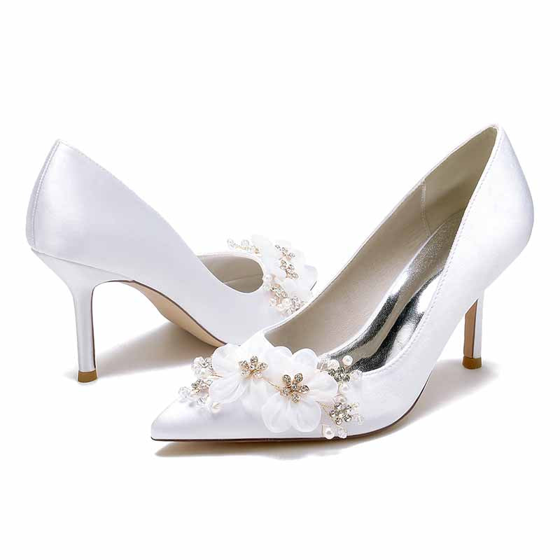 Elegant satin bridal heels with rhinestones and floral embellishments for a stunning wedding look