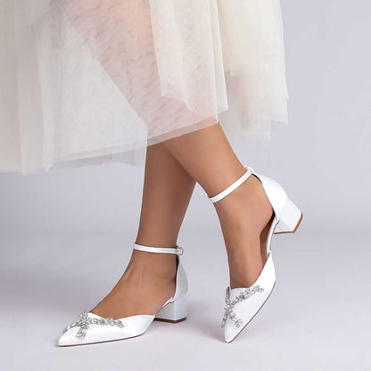 Elegant satin bridal shoes with rhinestones featuring a classic pointed toe and ankle strap design