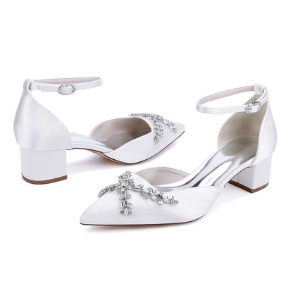 Elegant satin bridal shoes with rhinestones and a chic ankle strap for stylish weddings