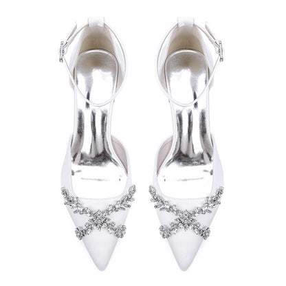 Elegant satin bridal shoes with rhinestones featuring a pointed toe and ankle strap design