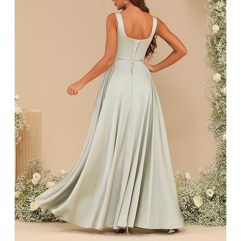 Elegant satin bridesmaid dresses long in soft green with a flowing skirt and lace-up back detail