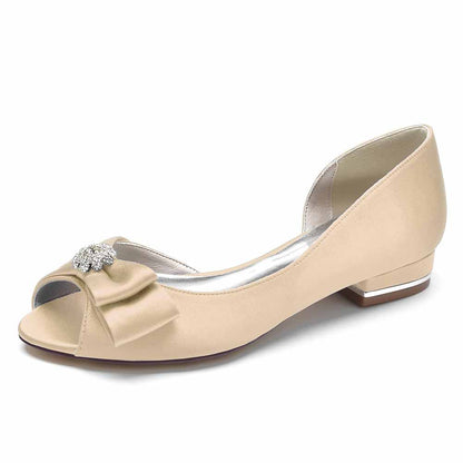 Open toe satin formal flats with elegant bow and decorative jewel for a stylish wedding look