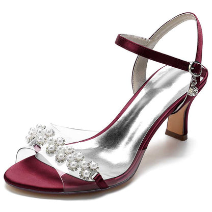 Elegant burgundy satin heeled sandals with pearls and clear straps for a chic look