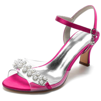 Satin heeled sandals with pearls featuring a stylish pink design and elegant ankle strap