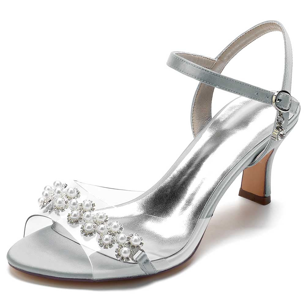 Elegant satin heeled sandals with pearls featuring a clear strap and adjustable ankle buckle