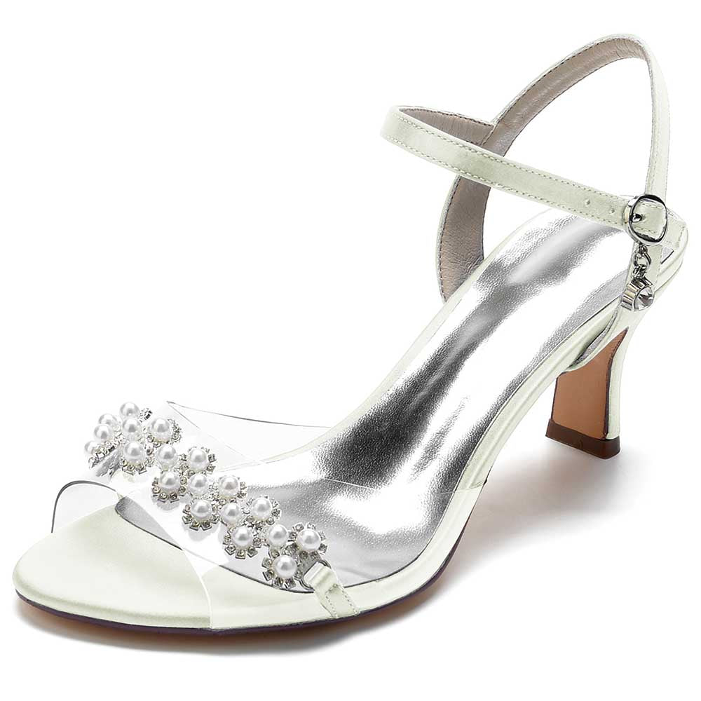Elegant satin heeled sandals with pearls featuring a clear strap and adjustable ankle buckle 