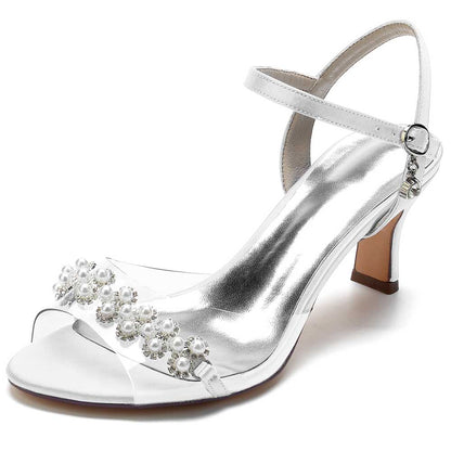 Elegant satin heeled sandals with pearls featuring a clear strap for a chic look