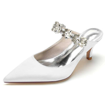 Elegant white satin high heel mule shoes with sparkling embellishments for a stylish look
