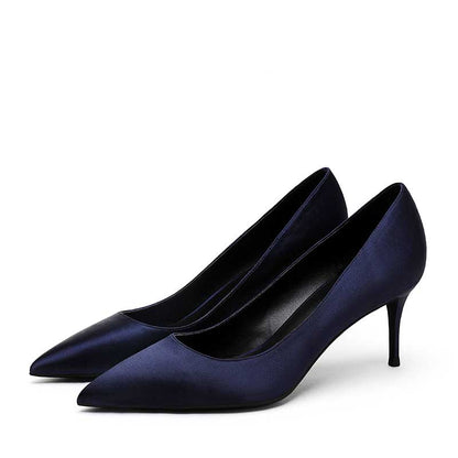 Elegant satin low heel party shoes in nude with a sleek pointed toe design for stylish events