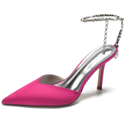 Pink satin prom heels with bling straps, featuring a pointed toe and elegant design for formal occasions