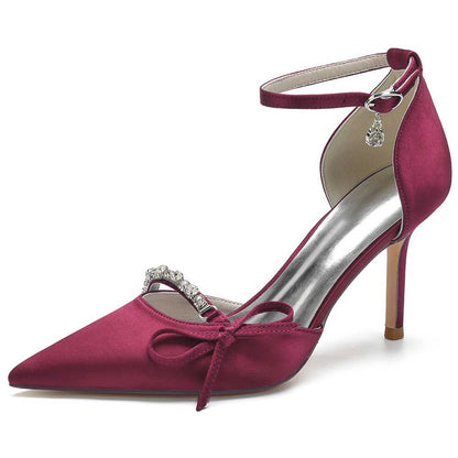Elegant satin prom heels with bow in burgundy featuring a pointed toe and ankle strap