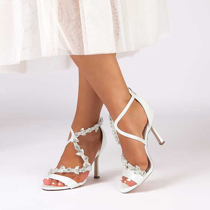 Elegant satin rhinestone wedding heels with delicate floral accents for bridal style