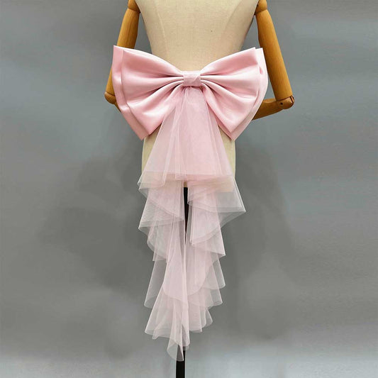Satin wedding bow for bridal dress in pink with tulle overlay and cascading design